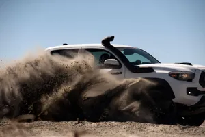 Toyota Trd Driving Through Dust Wallpaper