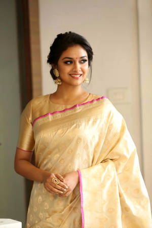 Traditional Elegance - Keerthi Suresh In Golden Saree Wallpaper