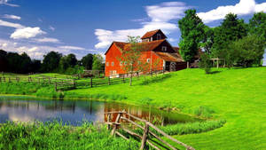 Tranquil Vermont Farmhouse Beside A Serene Pond Wallpaper