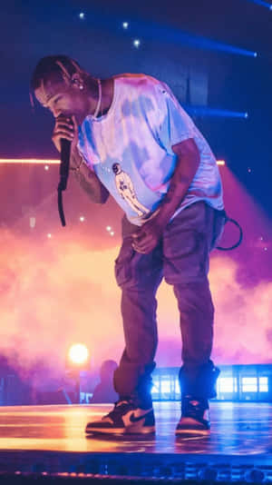 Travis Scott Performing On Stage Iphone Wallpaper
