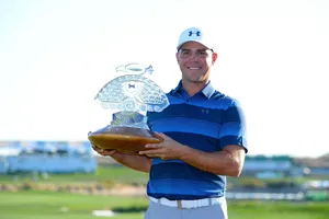 Triumph: Gary Woodland Proudly Holding His Golfing Trophy Wallpaper