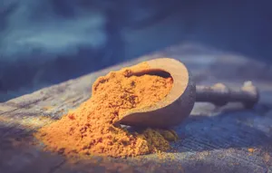 Turmeric Powder Scoop Wallpaper