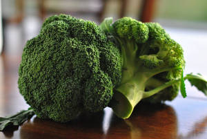 Two Broccoli On Brown Table Wallpaper