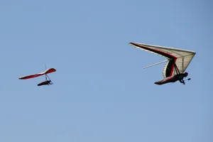 Two Men Hang Gliding Sports Adventure Wallpaper