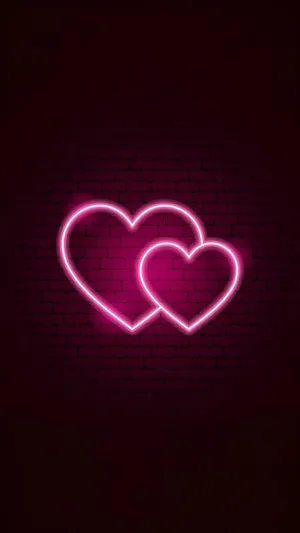 Two Pink Neon Hearts With Brick Wall Wallpaper
