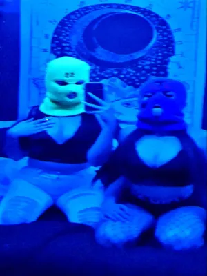 Two Ski Mask Girl Models Taking Selfie On Bed Wallpaper