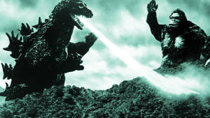 Two Titans Collide – Godzilla And Kong Battle It Out Wallpaper