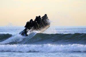 U S Navy Seals Riding A Dinghy Wallpaper