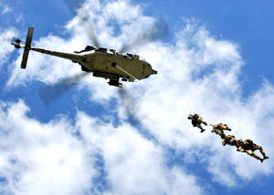 U S Navy Soldiers Dropping Off A Helicopter Wallpaper