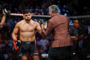 Ufc Fighter Kelvin Gastelum Fist Bump Moment Wallpaper