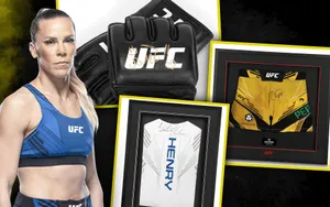 Ufc Star Katlyn Chookagian With Her Signed Merchandise Wallpaper