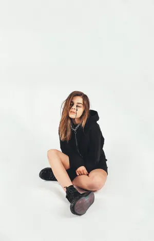 Unfiltered Billie Eilish Showing Off Her Unique Style Wallpaper