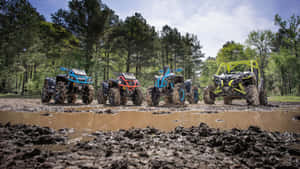 Unleashing The Power - Can-am X Mr Mud Lineup Atv In Action Wallpaper