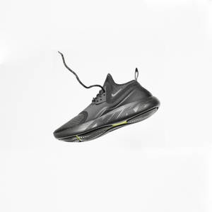 Unpaired Gray Nike Running Shoe Wallpaper