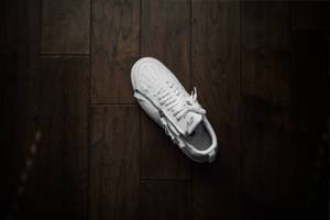 Unpaired White Nike Low-top Sneaker Wallpaper