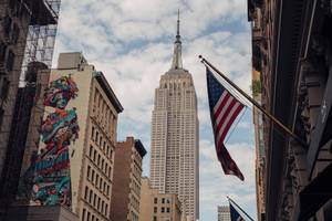 Us Flag In Madison Buildings Wallpaper