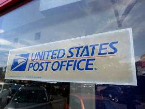 Usps Sign Behind Glass Wallpaper