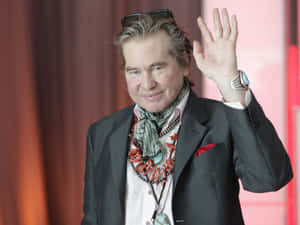 Val Kilmer Wavingat Event Wallpaper