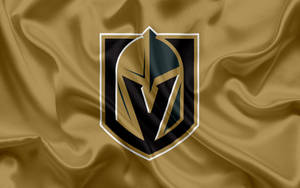 Vegas Knights Logo On Gold Silk Wallpaper