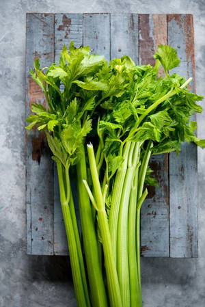 Vertical Celery Leaves On Board Wallpaper