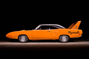 Vibrant 1970 Plymouth Superbird In Arresting Orange Wallpaper