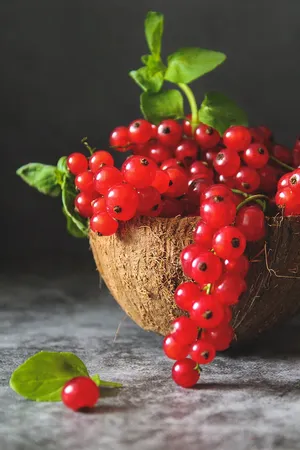 Vibrant Red Currant Berries In A Coconut Bowl Wallpaper