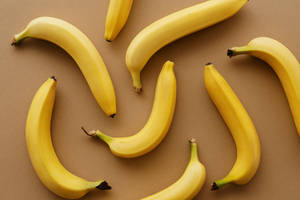 Vibrant Yellow Bananas In Disarray Wallpaper