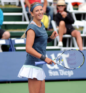 Victoria Azarenka Smiling In Gray Wallpaper