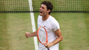 Victorious Shout - Taylor Fritz In His Moment Of Triumph Wallpaper