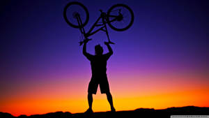 Victory Pose With A Bicycle Wallpaper