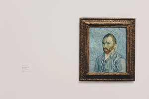 Vincent Van Gogh Self Portrait Painting On Wall Wallpaper