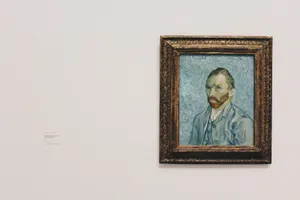 Vincent Van Gogh Self Portrait Painting On Wall Wallpaper