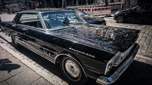 Vintage Black Car Street Scene Wallpaper