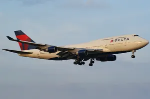 Vintage Delta Airlines Aircraft Mid-flight Wallpaper