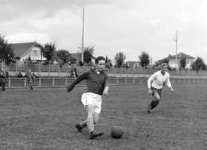 Vintage Football Match Action Wallpaper