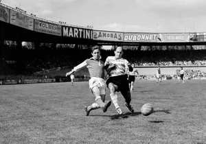 Vintage Football Match Action Wallpaper