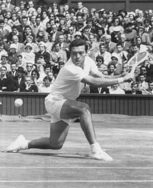 Vintage Tennis Player Action Shot Wallpaper