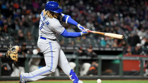 Vladimir Guerrero Jr Swinging Baseball Bat Wallpaper