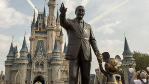 Walt Disney And Mickey Disneyworld Statue Wallpaper