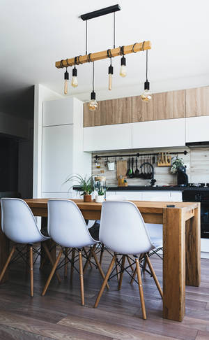 Warm, Rustic Kitchen With Wooden Table And White Nordic Chair Wallpaper