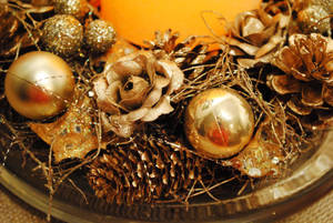 Warm Sparkly Golden Christmas Decorations Adorning A Beautiful Tree. Wallpaper
