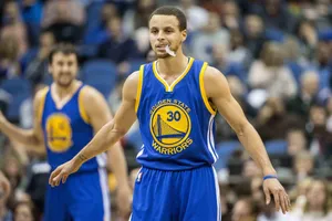 Warriors Basketball Player In Action Wallpaper