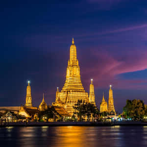 Wat Arun With Yellow Lights Wallpaper