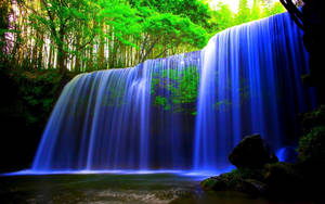 Watching The Sparkling Waterfall In The Great Outdoors Wallpaper