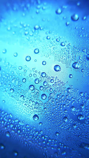 Water Droplets On A Blue Glass Wallpaper
