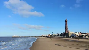 Waves Hitting Beach With Blackpool Tower In Background Wallpaper