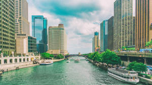 White And Blue Boat On Water Near City Buildings During Daytime Wallpaper