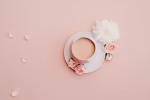 White Glazed Cup With Saucer On Pink Surface Wallpaper