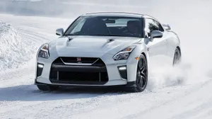 White Nissan R35 Gtr Car Snowy Road Wallpaper