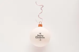 White Ornament With Merry Christmas And Ribbon Wallpaper